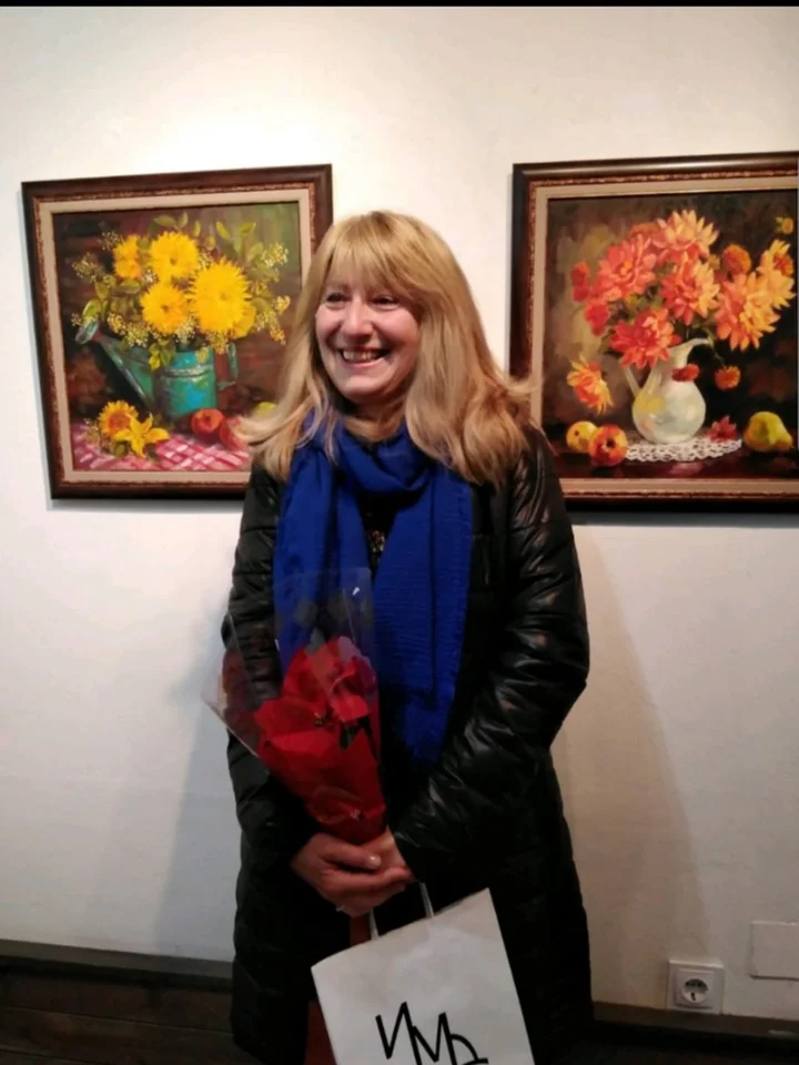 Vasilka Sotirova with one of her paintings